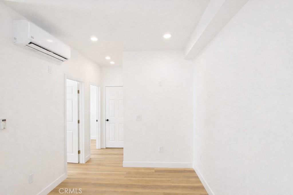 625 Orizaba Avenue, Unit 5 Long Beach, CA 90814 - Photo 11 of 12 a view of a hallway with wooden floor