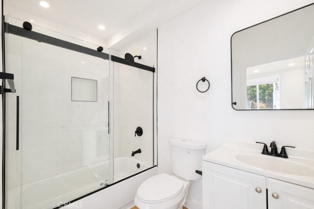 625 Orizaba Avenue, Unit 5 Long Beach, CA 90814 - Photo 8 of 12 a bathroom with a sink a toilet and shower