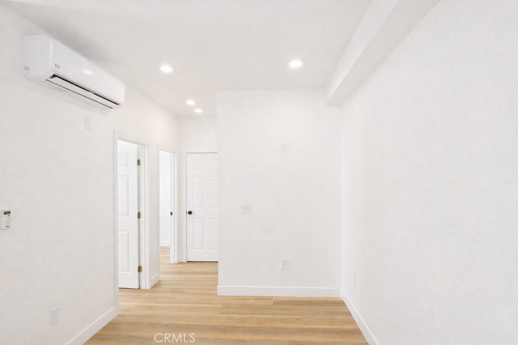 625 Orizaba Avenue, Unit 5 Long Beach, CA 90814 - Photo 10 of 12 a view of a hallway with wooden floor