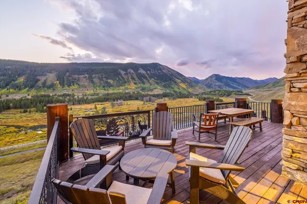 a view of a chairs and table in patio