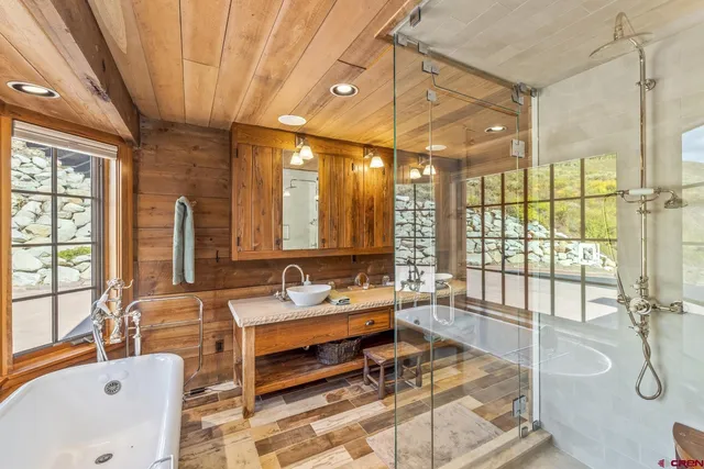 a very nice looking room with a large window and furniture