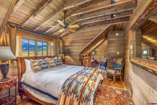 a bed room with a bed and a table