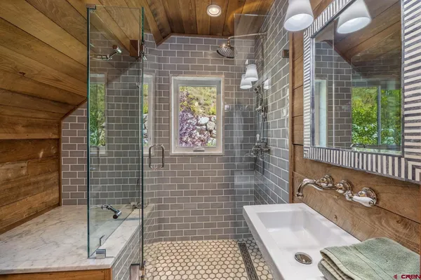 a bathroom with a sink and a shower
