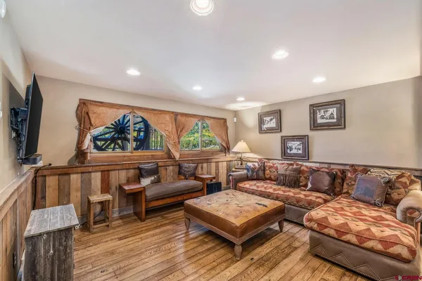 a living room with furniture and a flat screen tv