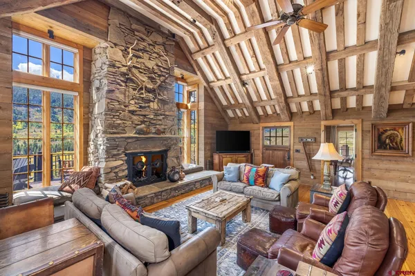 a living room with furniture fireplace and a flat screen tv
