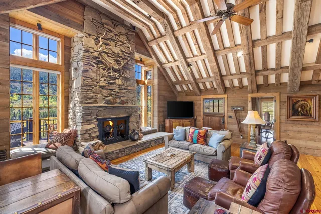 a living room with furniture fireplace and a flat screen tv