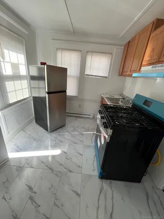 a kitchen with a stove and a refrigerator