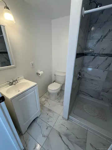 a view of bathroom with a sink and a toilet