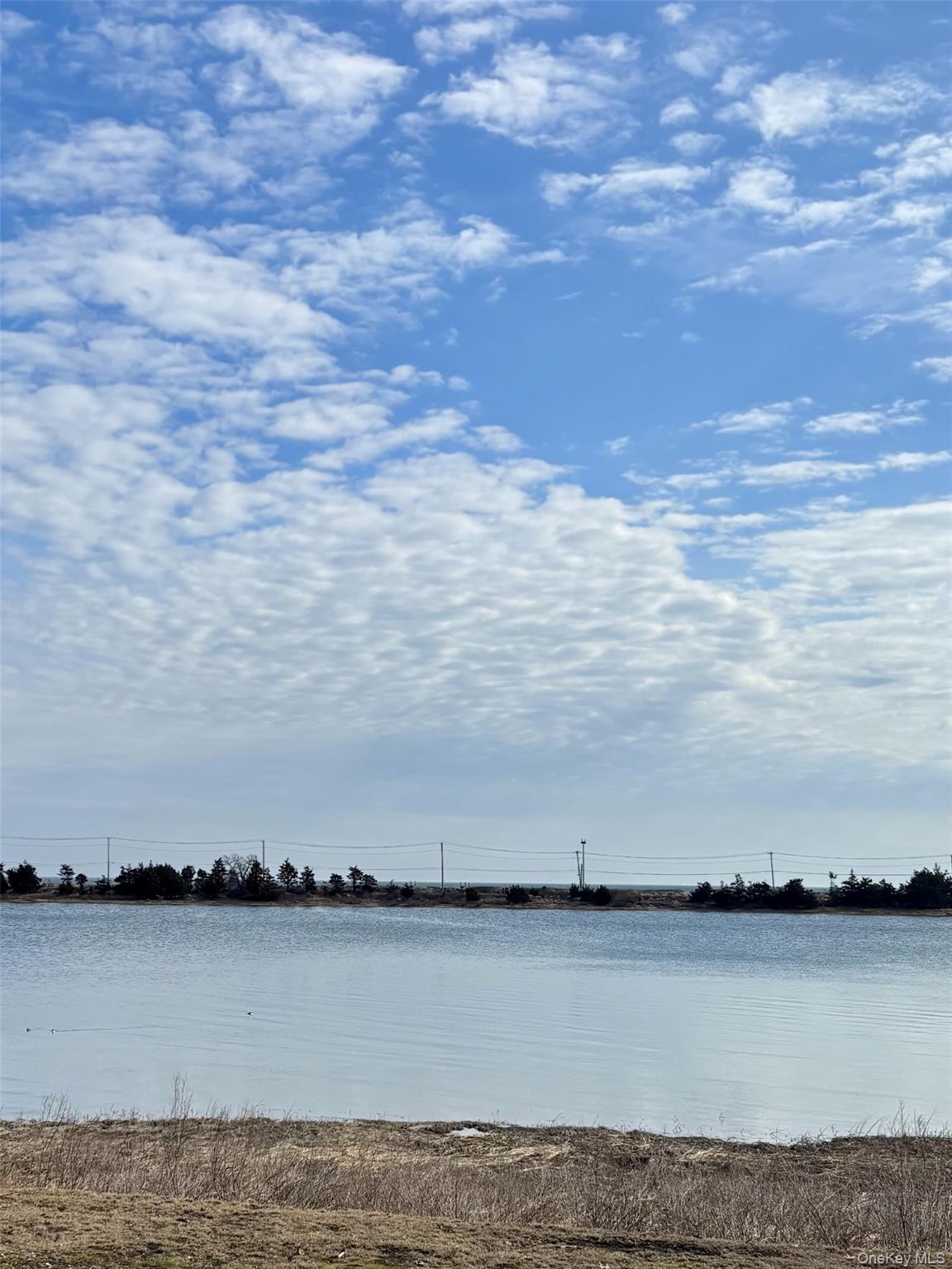 24 Bevin Road Northport, NY 11768 - Photo 3 of 3 a view of ocean with beach
