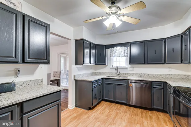 a kitchen with lots of counter space sink and appliances