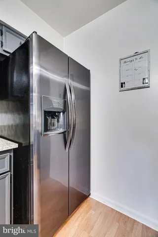 a view of a refrigerator in a kitchen