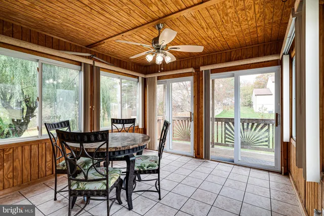 a view of a dining room with furniture water view and balcony
