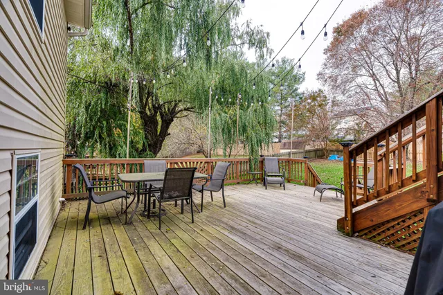 a view of a house with a patio and wooden flooring