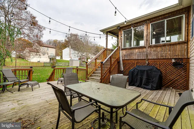 a view of a patio with iron fence