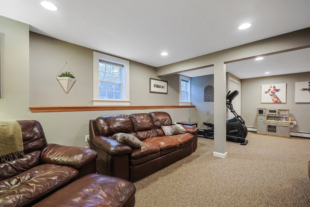 26 Reservoir Road Milford, MA 01757 - Photo 28 of 42 a living room with furniture and a couch