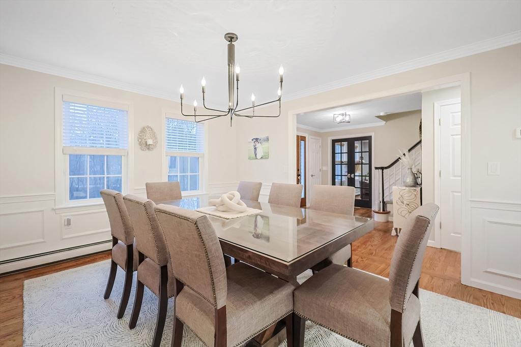 26 Reservoir Road Milford, MA 01757 - Photo 8 of 42 a view of a dining room with furniture and wooden floor