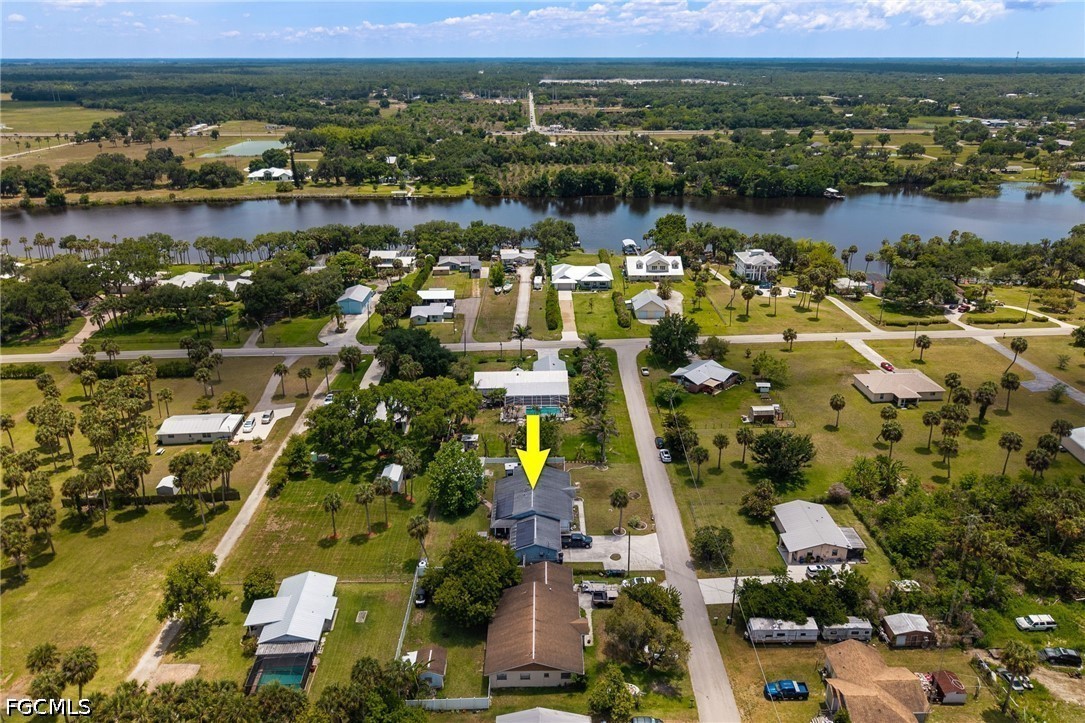 an aerial view of lake residential houses with outdoor space and lake view