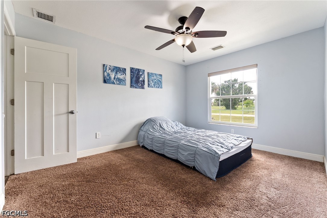 17290 Rewis Road Alva, FL 33920 - Photo 17 of 50 a living room with a bed and a window