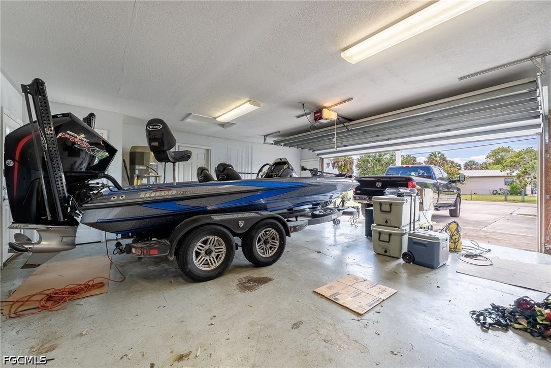 17290 Rewis Road Alva, FL 33920 - Photo 23 of 50 a car parked in a garage