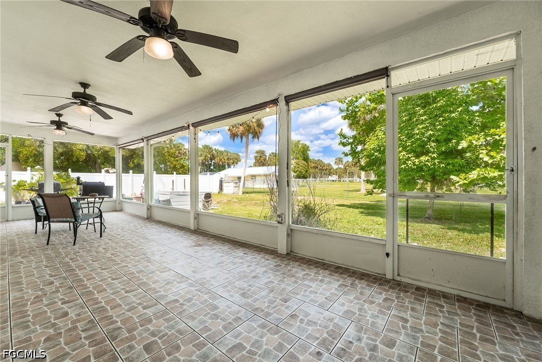 17290 Rewis Road Alva, FL 33920 - Photo 25 of 50 a view of a porch with furniture and a yard