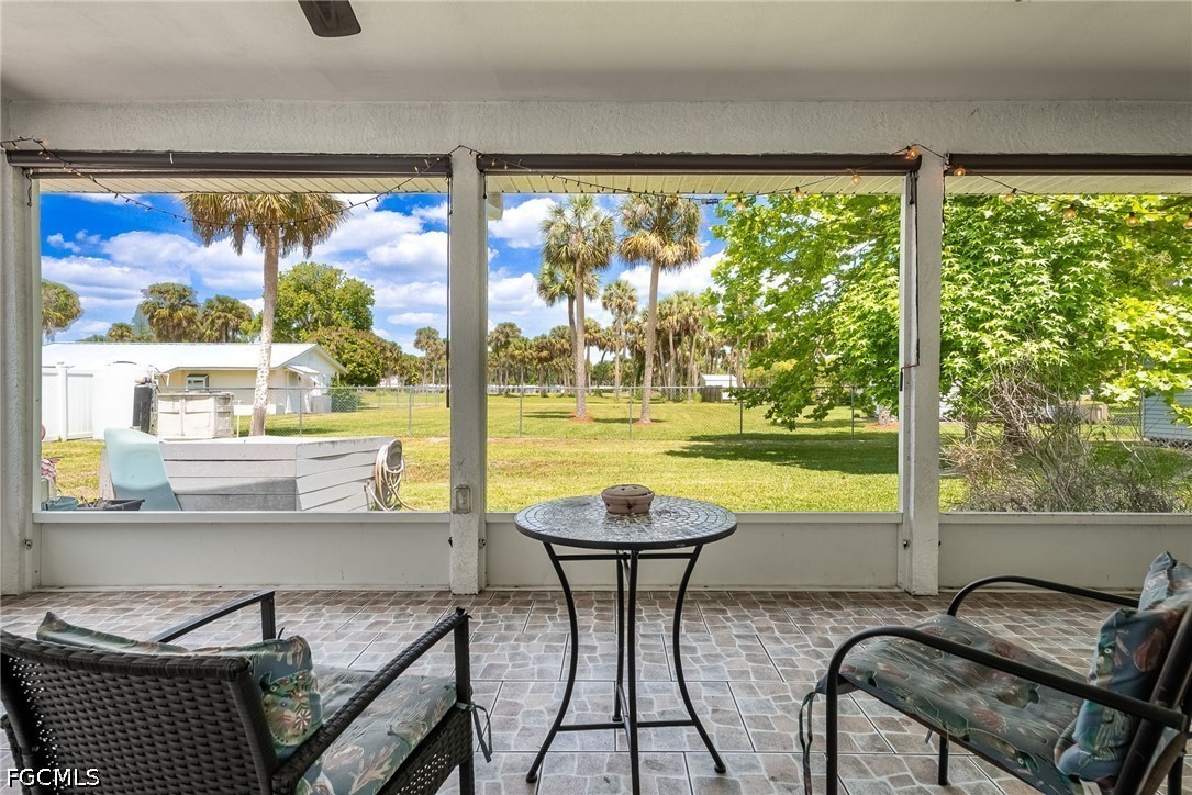 17290 Rewis Road Alva, FL 33920 - Photo 26 of 50 a view of a chairs and table in balcony
