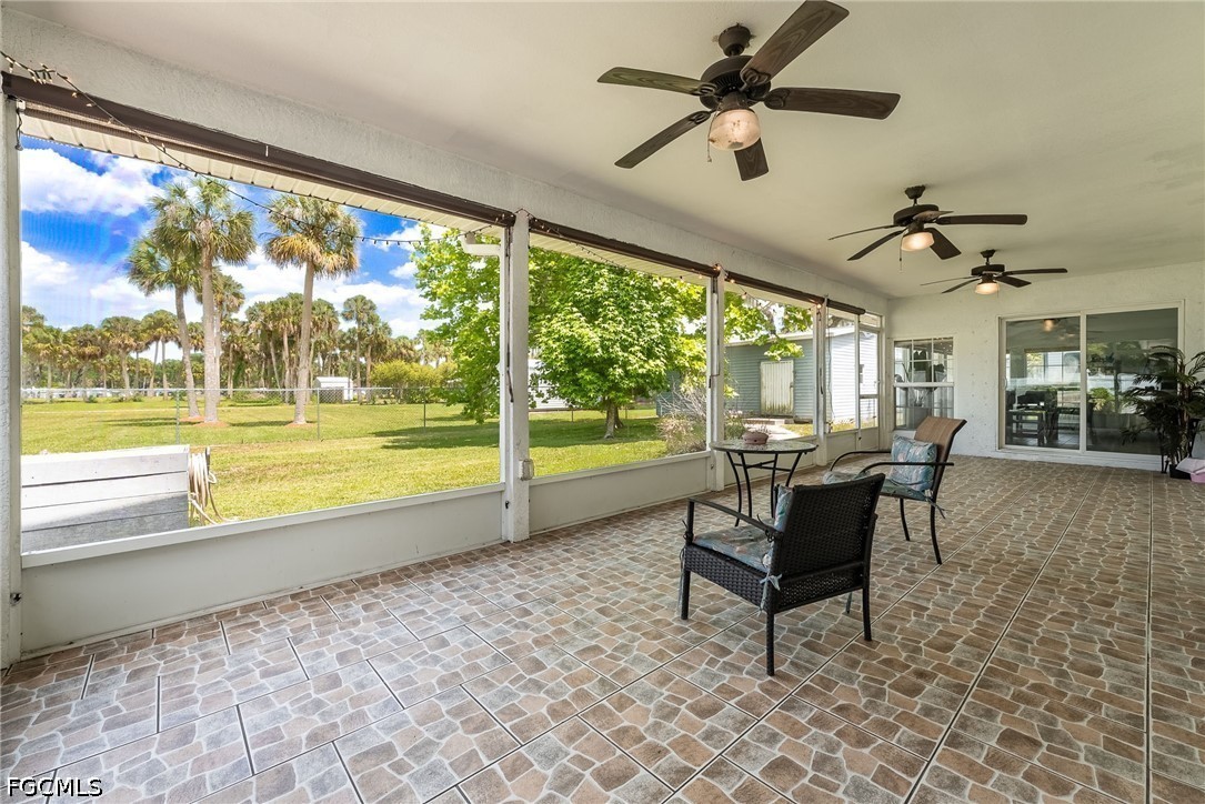 17290 Rewis Road Alva, FL 33920 - Photo 27 of 50 a living room filled with furniture and a large window