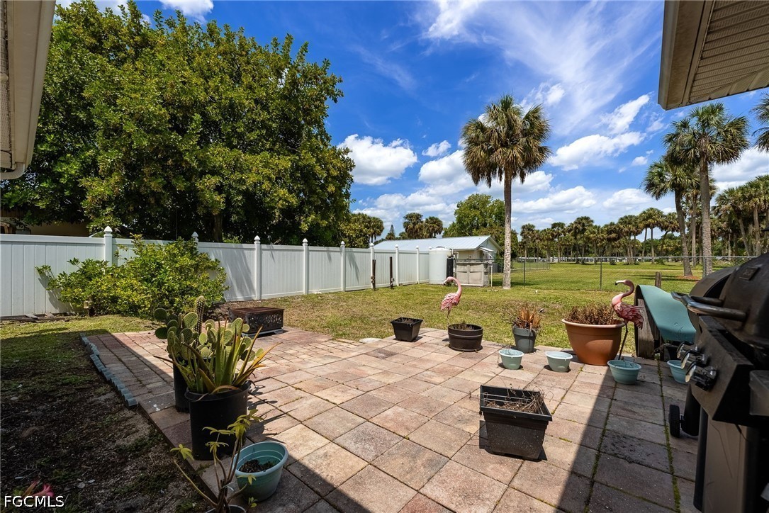 17290 Rewis Road Alva, FL 33920 - Photo 28 of 50 a view of a backyard with sitting area