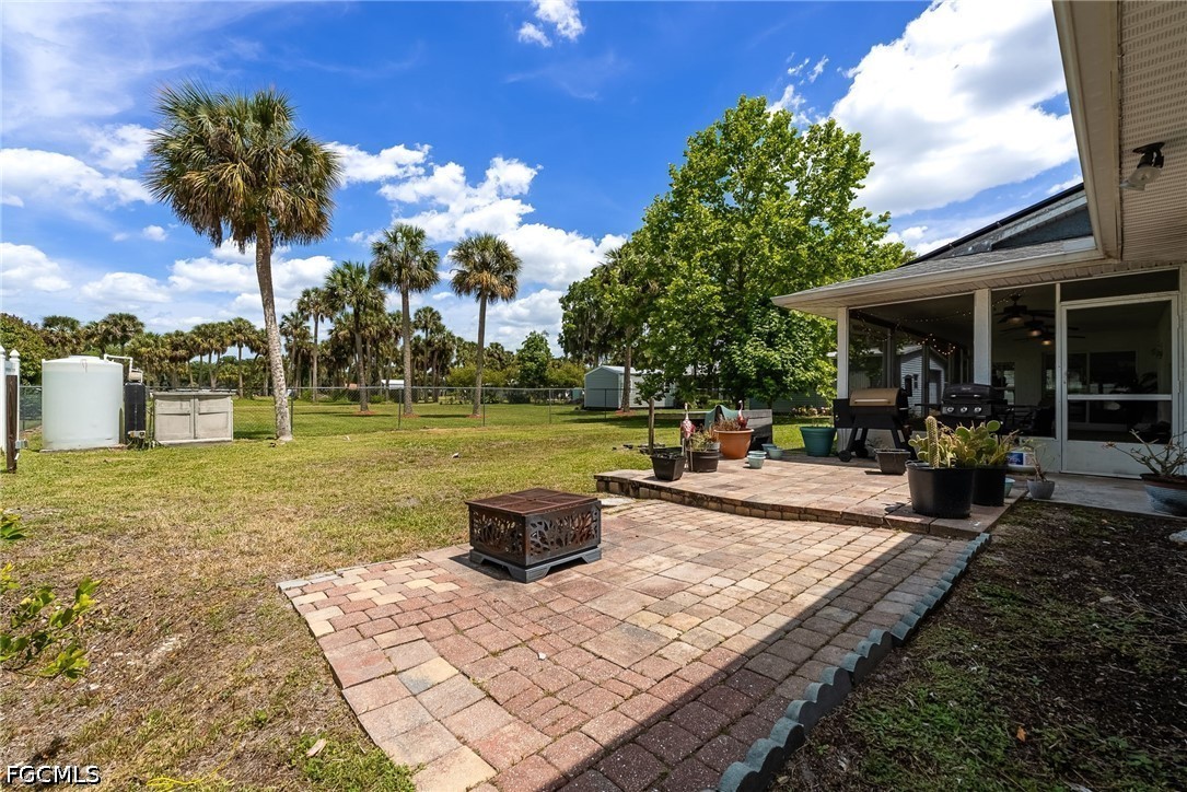 17290 Rewis Road Alva, FL 33920 - Photo 29 of 50 a view of a backyard with a patio