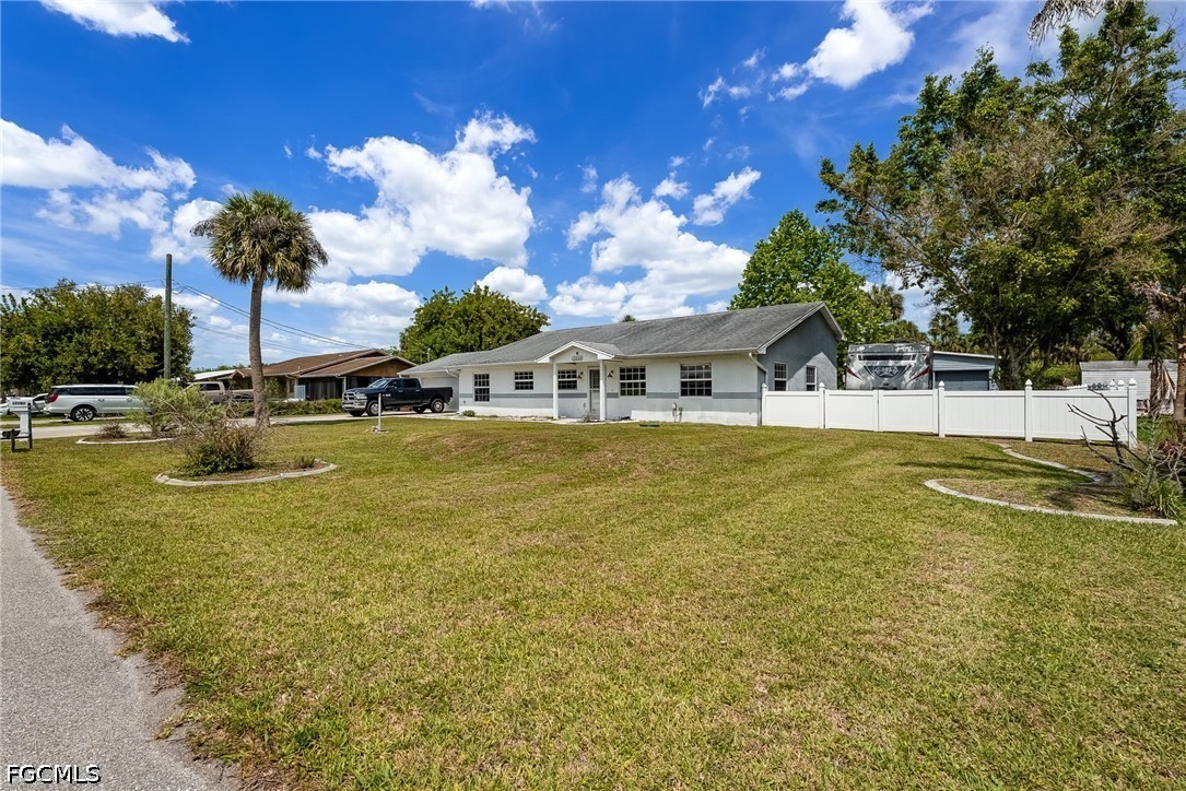 17290 Rewis Road Alva, FL 33920 - Photo 3 of 50 a swimming pool with outdoor seating and yard