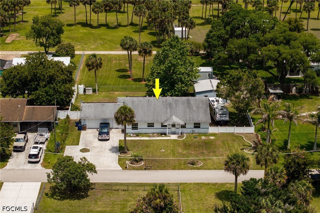 17290 Rewis Road Alva, FL 33920 - Photo 35 of 50 an aerial view of a house with swimming pool and outdoor seating