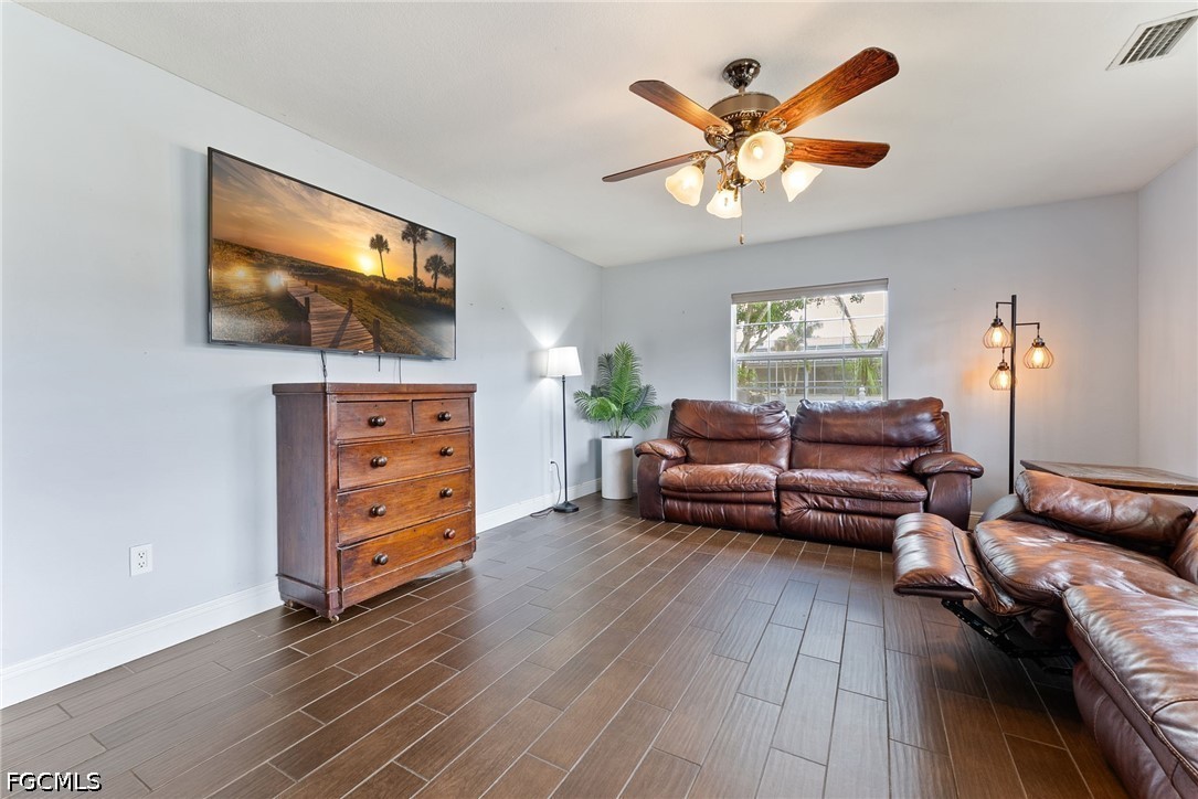 17290 Rewis Road Alva, FL 33920 - Photo 6 of 50 a living room with furniture and a flat screen tv