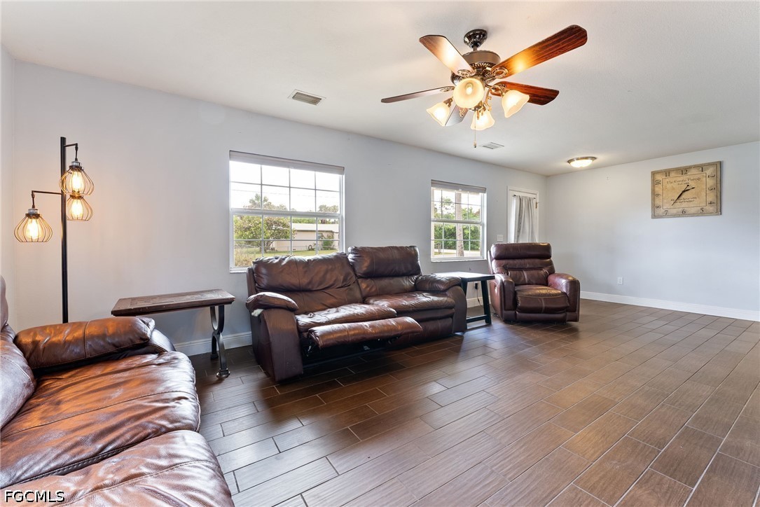17290 Rewis Road Alva, FL 33920 - Photo 8 of 50 a living room with furniture and a large window