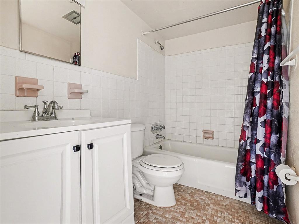 2500 Lee Road, Unit 237 Winter Park, FL 32789 - Photo 12 of 23 a bathroom with a sink toilet and shower