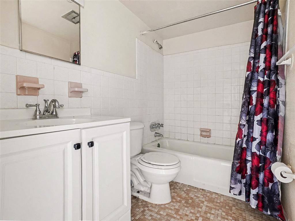 2500 Lee Road, Unit 237 Winter Park, FL 32789 - Photo 13 of 23 a bathroom with a sink toilet and shower