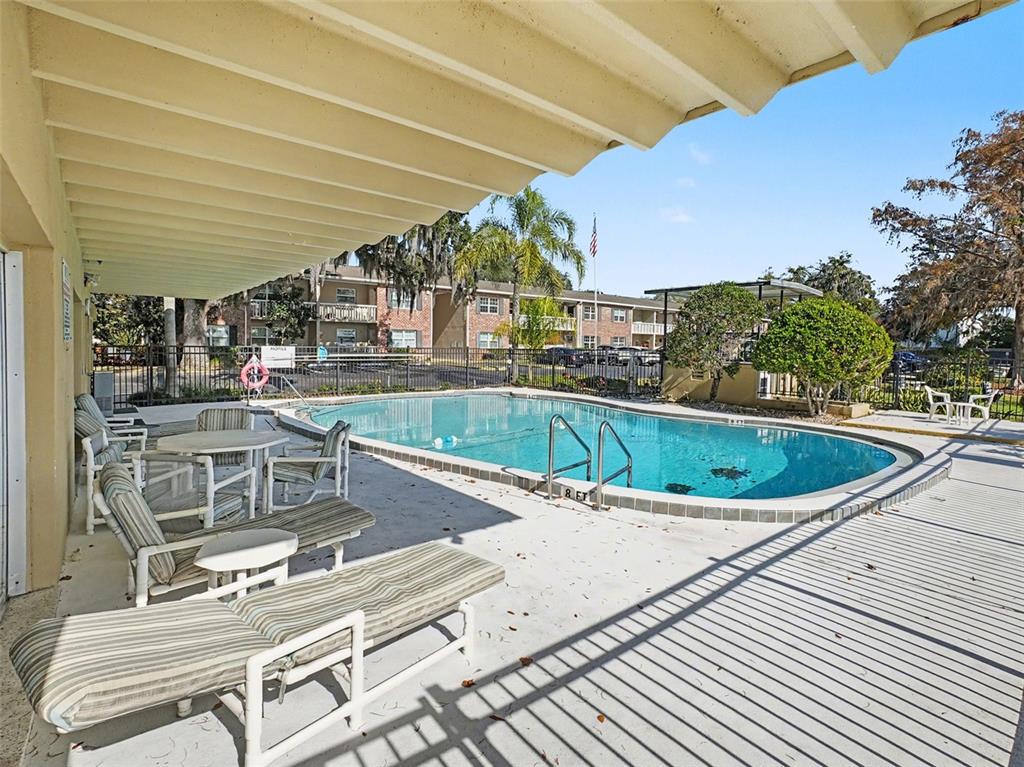 2500 Lee Road, Unit 237 Winter Park, FL 32789 - Photo 21 of 23 a view of a swimming pool with outdoor seating