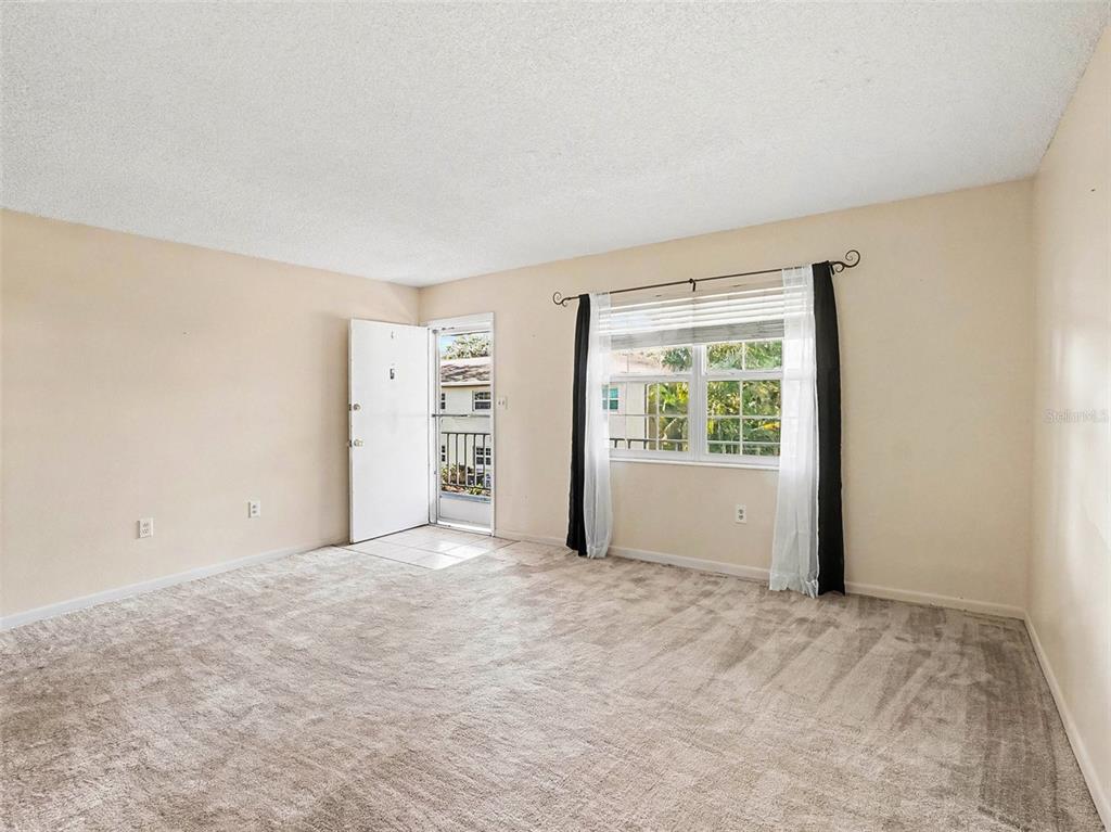 2500 Lee Road, Unit 237 Winter Park, FL 32789 - Photo 8 of 23 an empty room with windows and closet