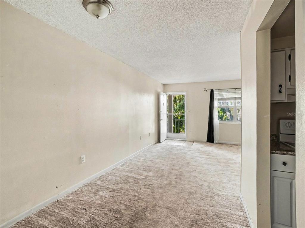2500 Lee Road, Unit 237 Winter Park, FL 32789 - Photo 9 of 23 an empty room with window and outdoor view