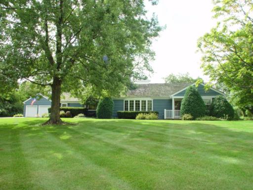 741 Braeburn Road Inverness, IL 60067 - Photo 1 of 10 a view of a house with a big yard and large trees