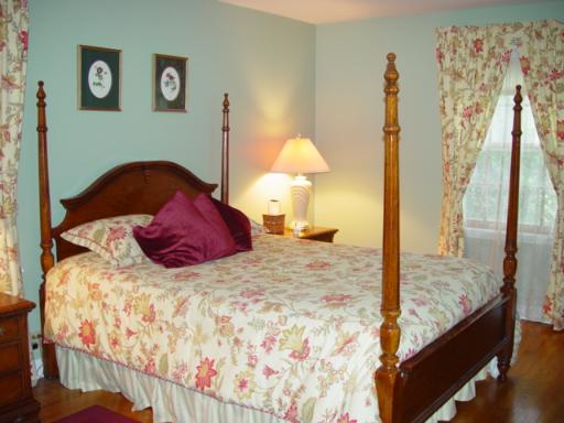 741 Braeburn Road Inverness, IL 60067 - Photo 6 of 10 a large bed sitting in a bedroom next to a window