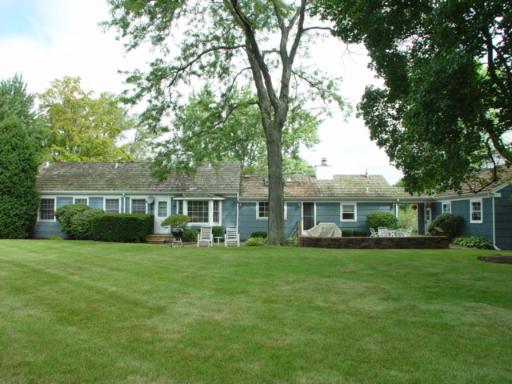 741 Braeburn Road Inverness, IL 60067 - Photo 10 of 10 a front view of a house with a garden and trees