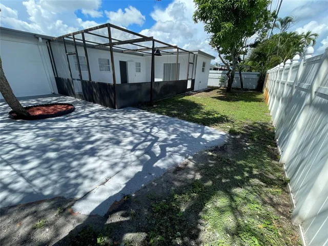 a house view with a backyard space