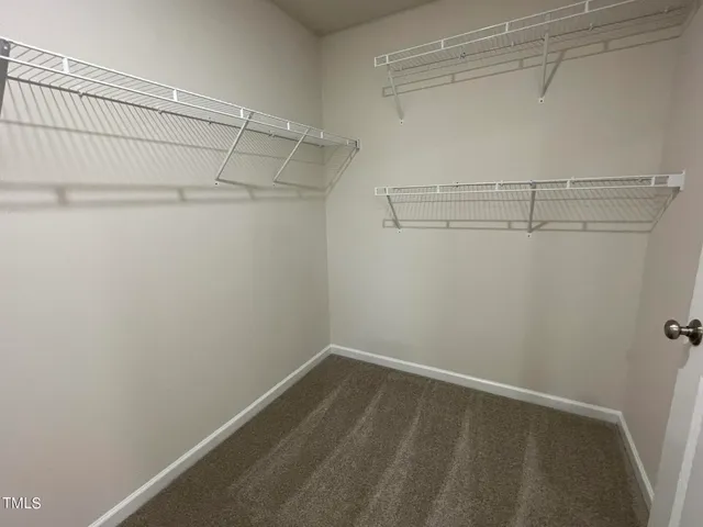 a view of a room with racks on the wall