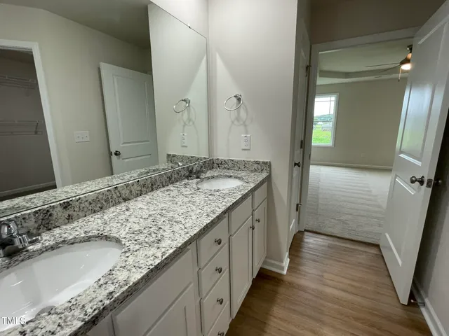 a bathroom with a sink and a large mirror
