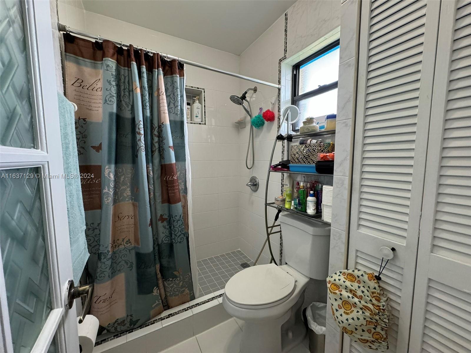 231 East 7th Street Hialeah, FL 33010 - Photo 19 of 39 a bathroom with a sink toilet and shower