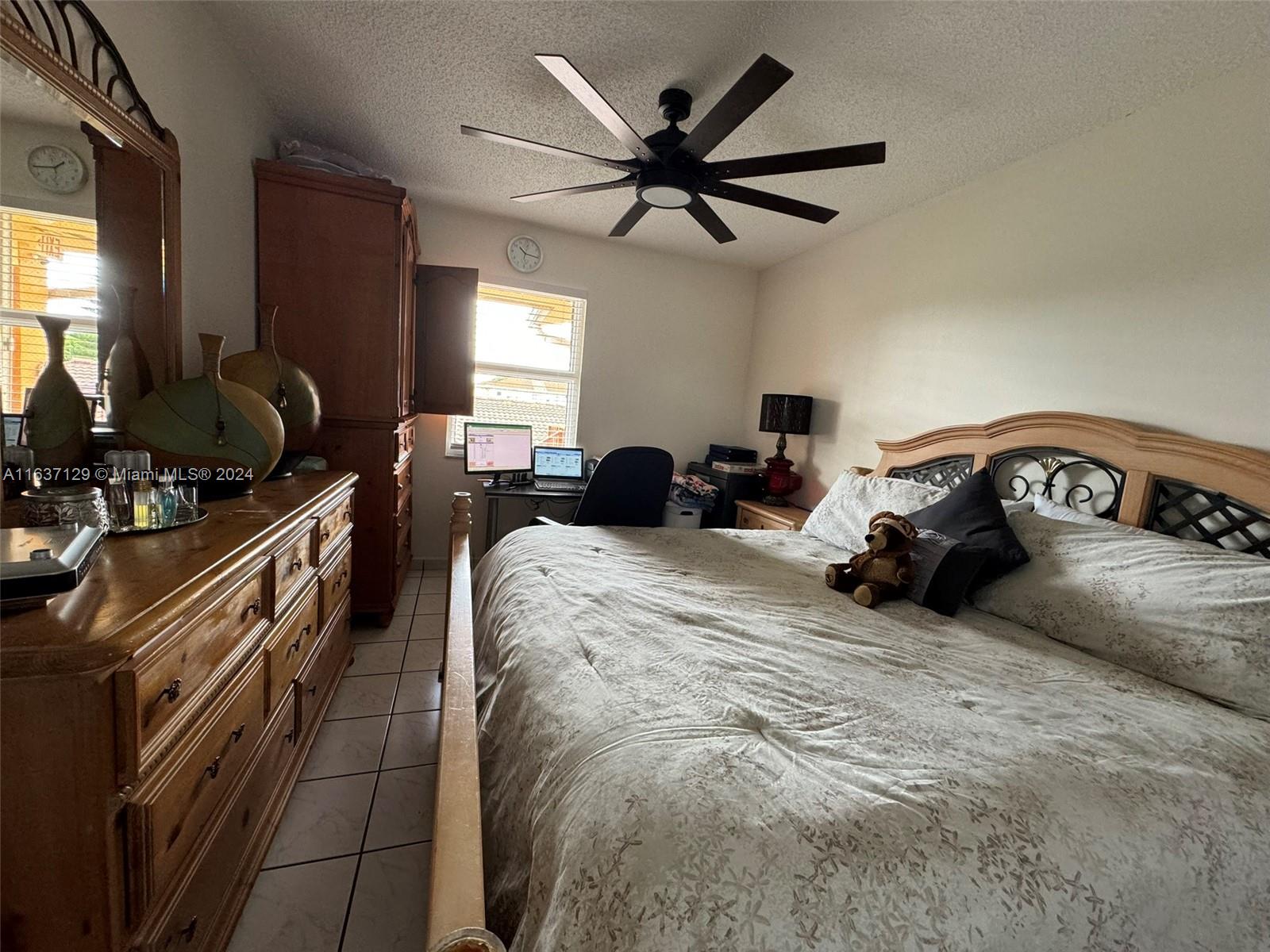 231 East 7th Street Hialeah, FL 33010 - Photo 22 of 39 a bedroom with a bed and window