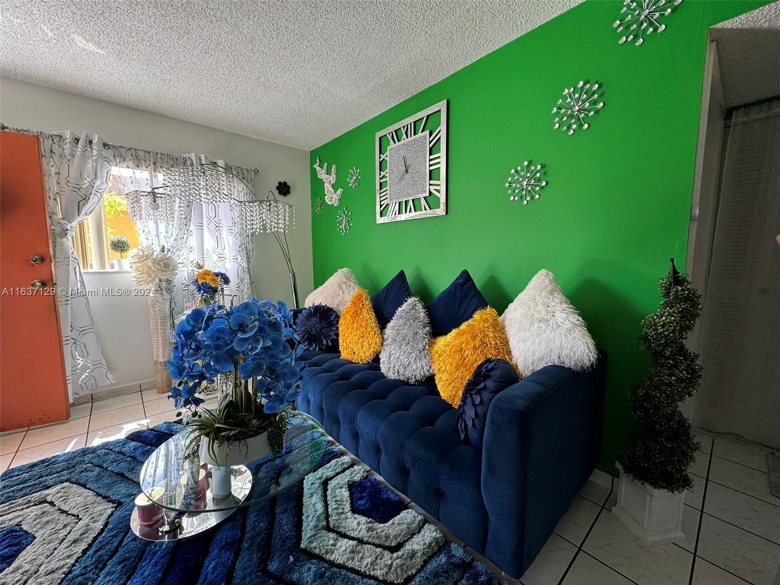 231 East 7th Street Hialeah, FL 33010 - Photo 26 of 39 a living room with furniture and a large window