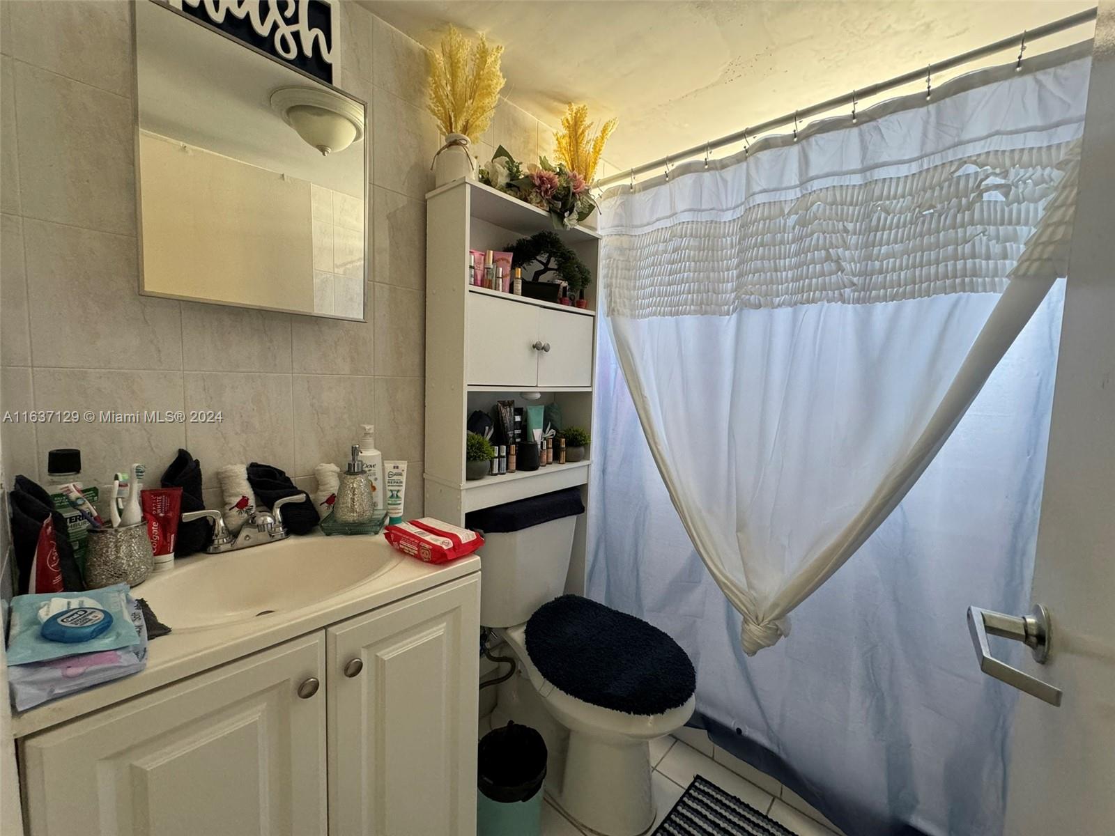 231 East 7th Street Hialeah, FL 33010 - Photo 35 of 39 a bathroom with a sink toilet and shower