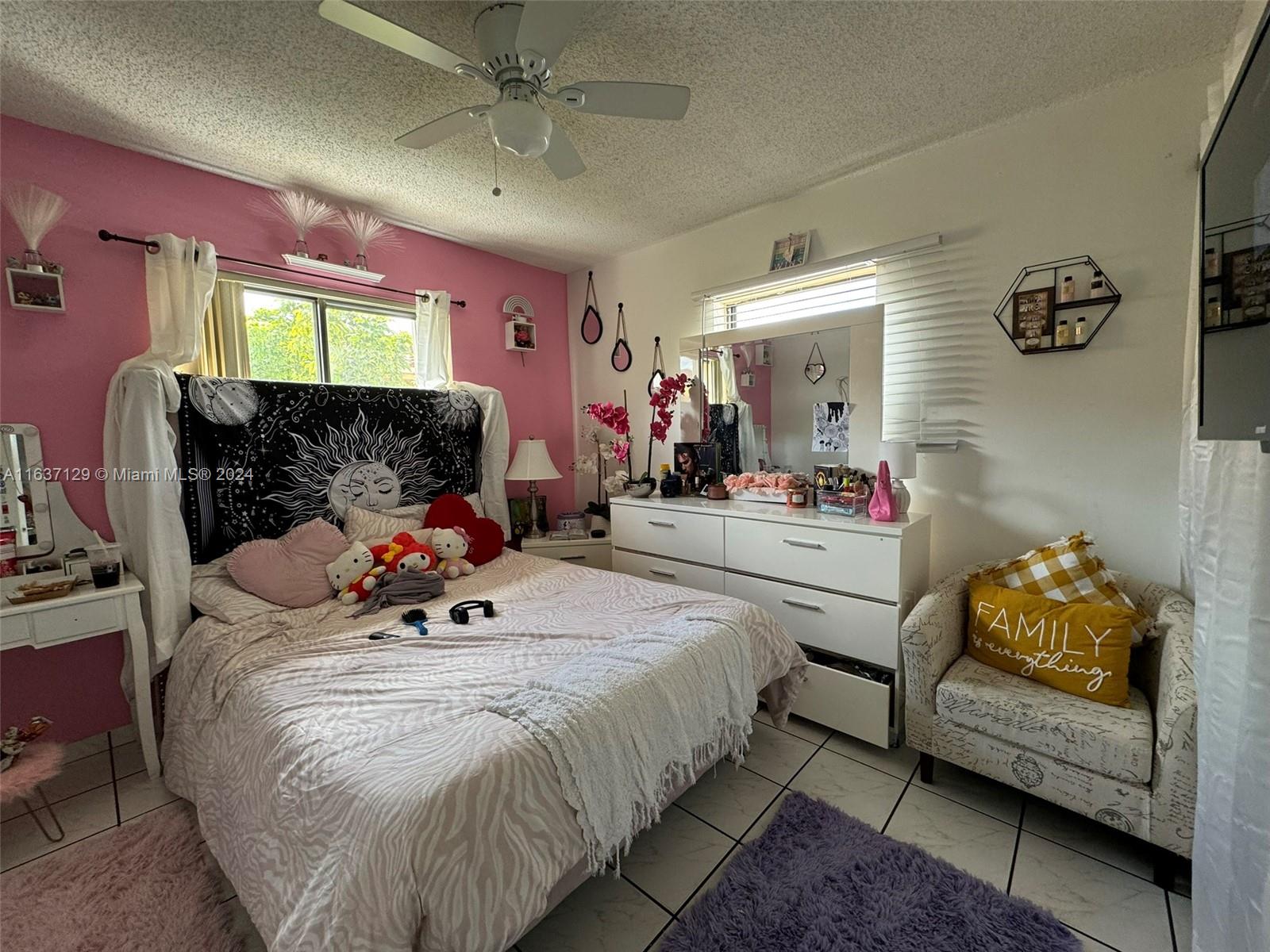 231 East 7th Street Hialeah, FL 33010 - Photo 37 of 39 a bed room with a bed and a couch