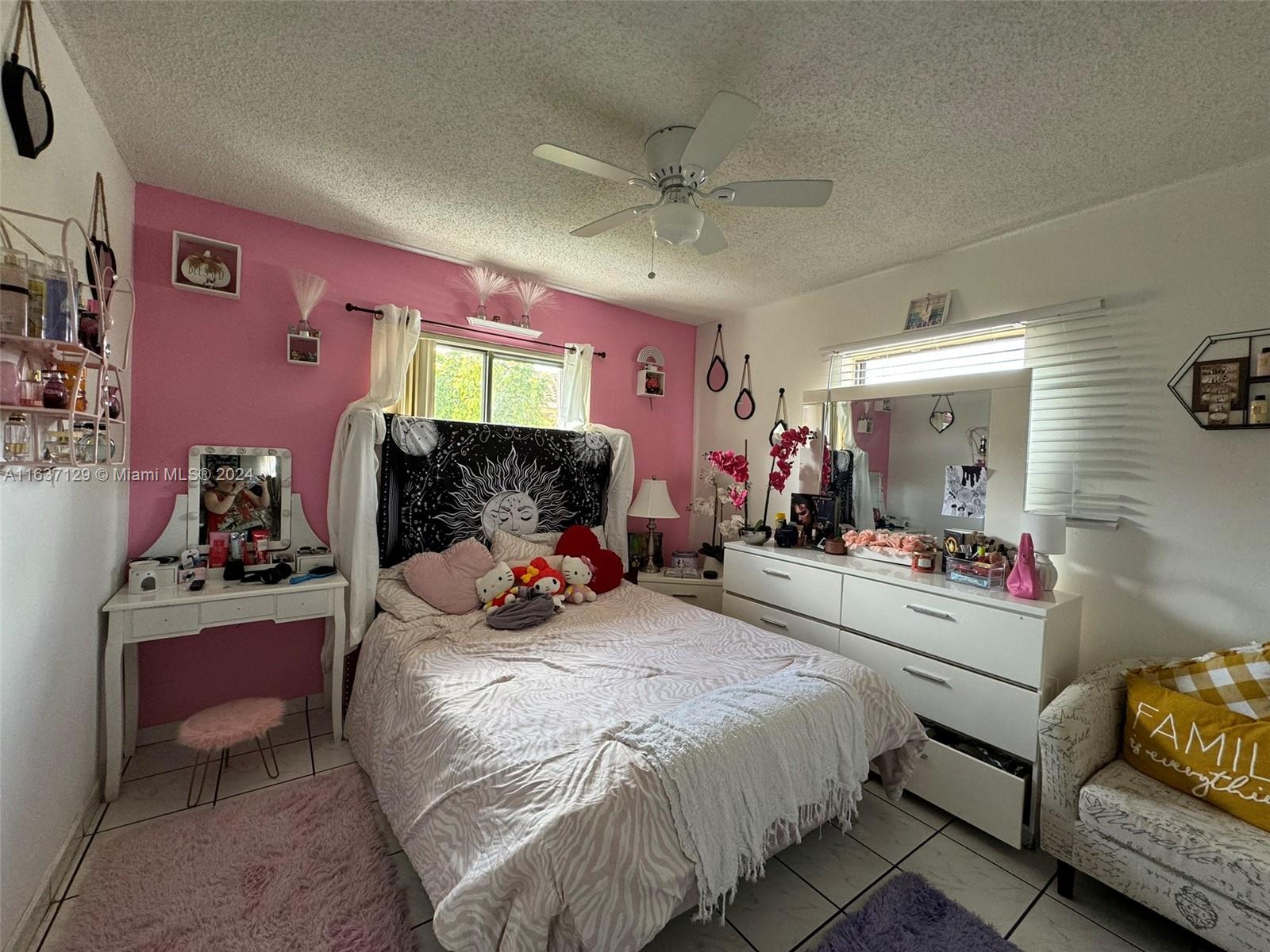 231 East 7th Street Hialeah, FL 33010 - Photo 38 of 39 a bedroom with bed and window