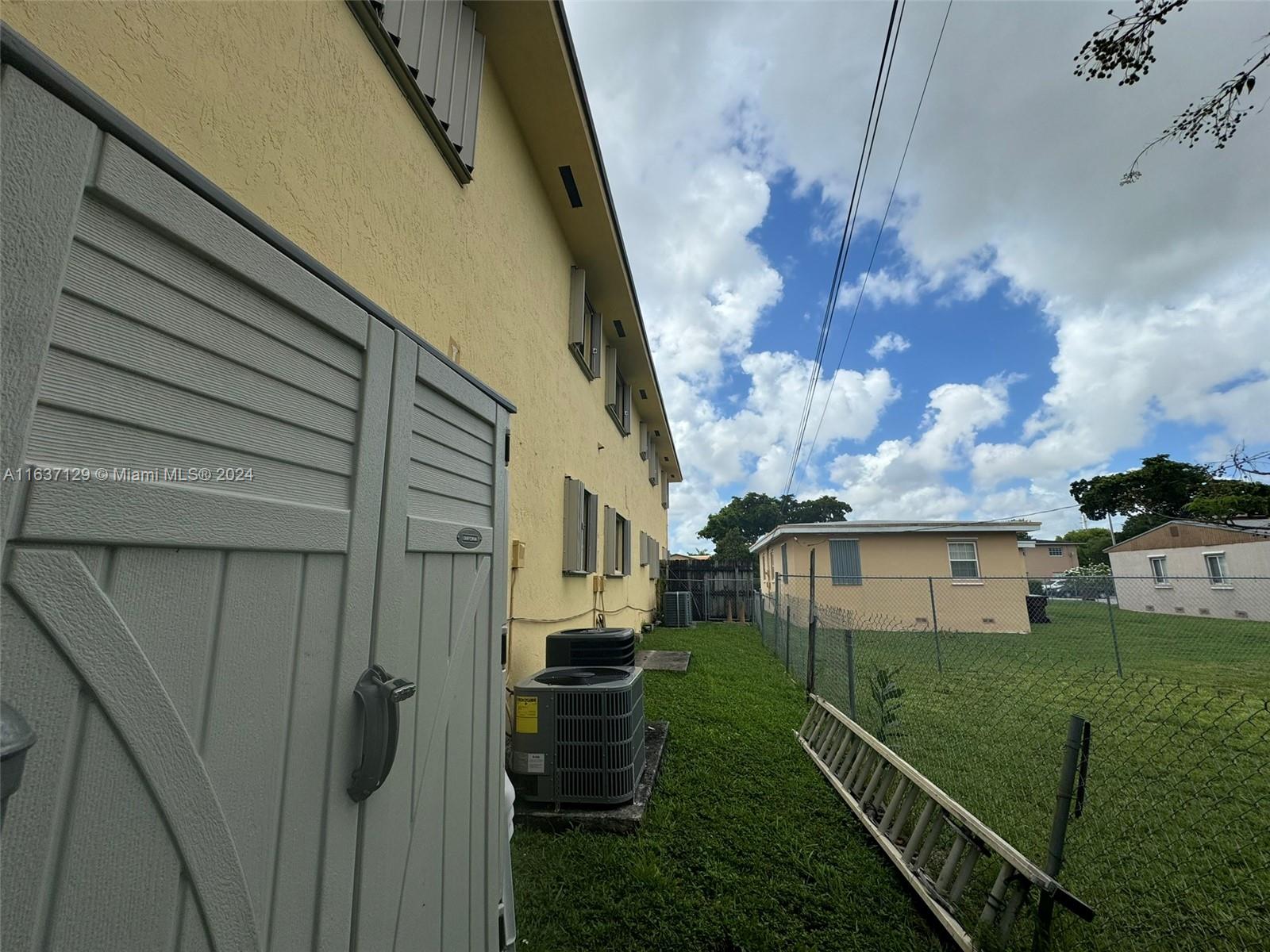 231 East 7th Street Hialeah, FL 33010 - Photo 9 of 39 a view of a house with a yard
